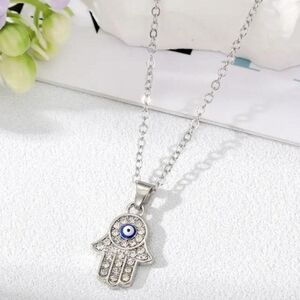 Dazzling Silver Hamsa Necklace with Blue Accent